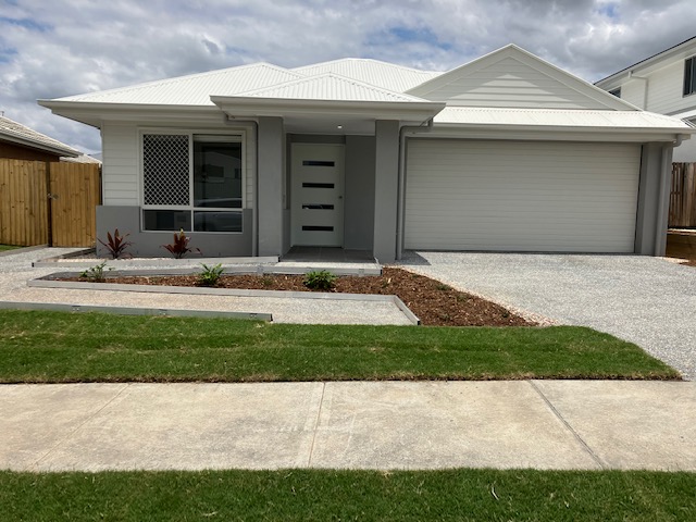 Front view of a modern SDA-compliant house in Greenbank, Queensland, used in a High Physical Support NDIS tenancy.